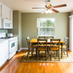The bright full kitchen and dining area is the perfect place to have a meal
